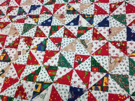 Items similar to Christmas Pinwheel lap quilt on Etsy