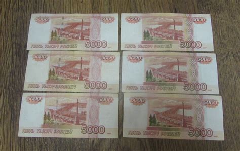 Купюры в 5000 рублей с разным цветом герба Хабаровска. Определяем ...