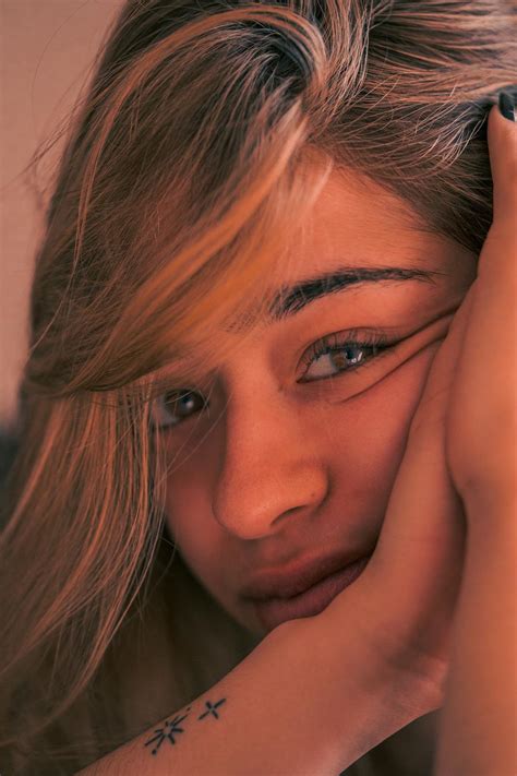Woman Leaning Face on Hands · Free Stock Photo
