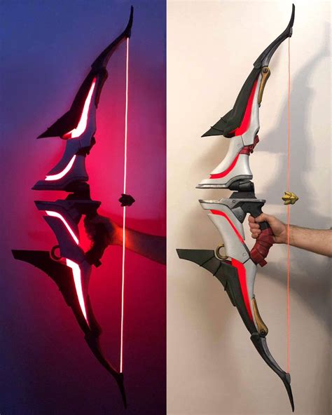 two different angles of the same bow and arrow, one being held up by ...