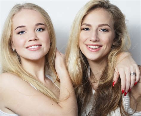 Premium Photo | Young girlfriends standing together and having fun