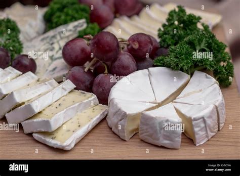 cheese board camembert  herbs decorated  grapes  parsley
