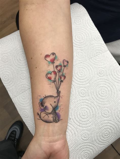 unique elephant tattoos  wrist small simple  meaningful design