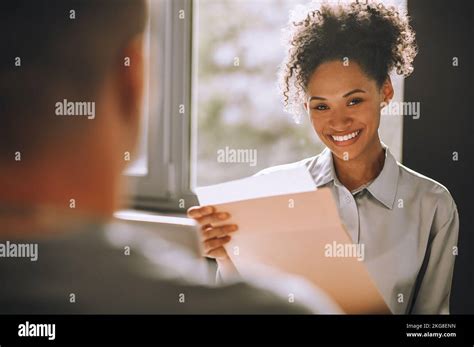 pleased young female boss  documents   stock photo alamy