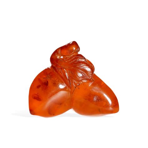 At Auction: Amber peach of longevity in Qing Dynasty.
