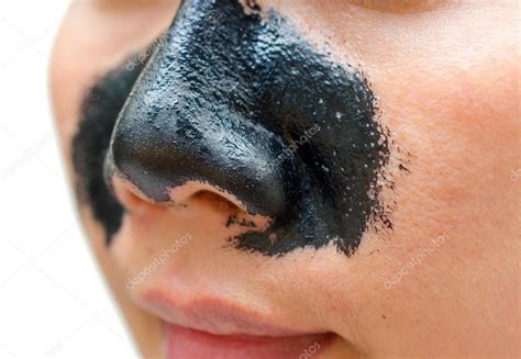 Woman applying strips on nose for acne — Stock Photo © casanowe1 #49050499