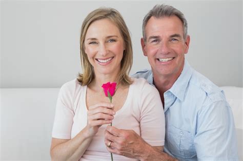 Premium Photo | Happy romantic couple with a flower