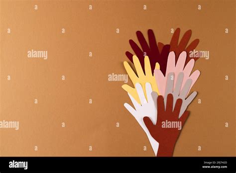 paper cut   multi coloured hands  copy space  brown