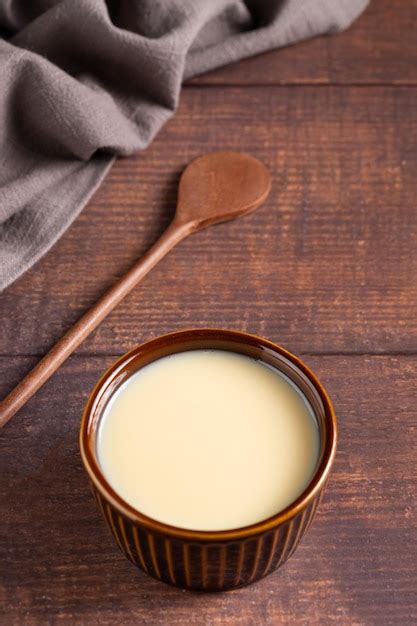 Premium Photo | Fresh condensed milk in the bowl