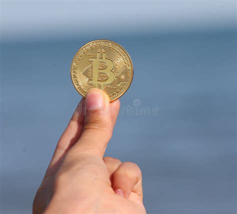 Hand with a Coin with the Capital Letter B Symbolizing the Crypt Stock ...