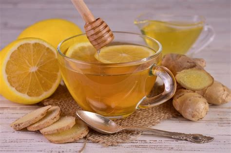 premium photo ginger tea  lemon  honey   transparent cup