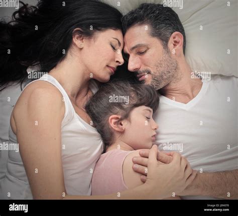 Father and daughter sleeping bed hi-res stock photography and images