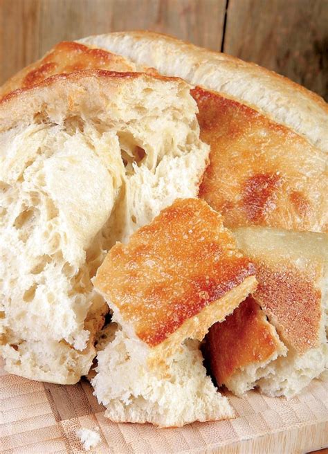 Artisan Bread Loaf on Cutting Board - Prepared Food Photos, Inc.