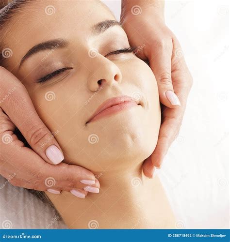 Beautiful, Young and Healthy Woman Having Face Massage in Spa Salon ...