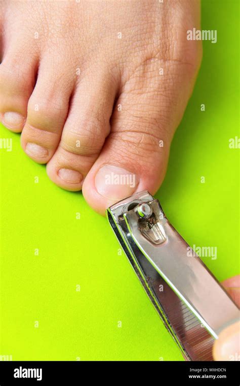 Cutting your toenails Stock Photo - Alamy