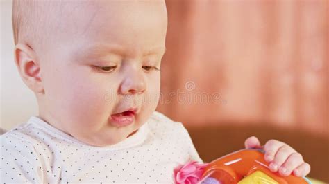 Baby Sitting and Playing with a Toy Stock Image - Image of finger, caucasian: 105416933