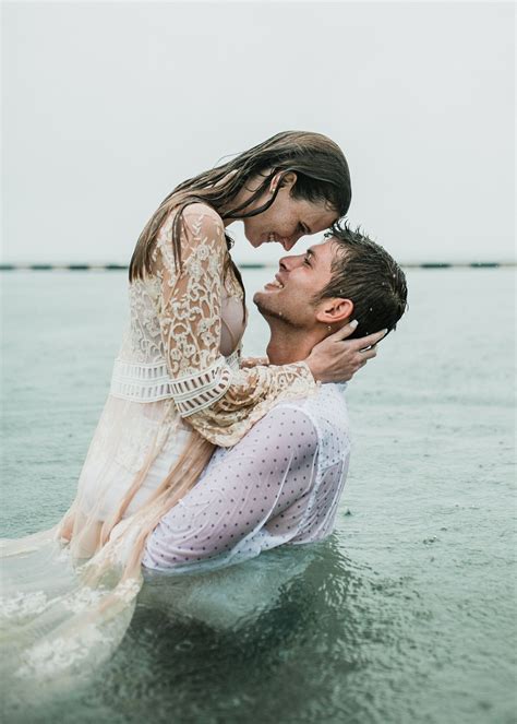 Couple posing in the rain. Notebook kiss. Key West wedding photographer