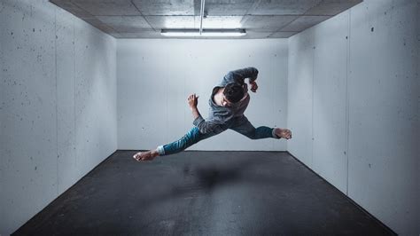 Anonymous naked woman dancing gracefully in dark studio · Free Stock Photo