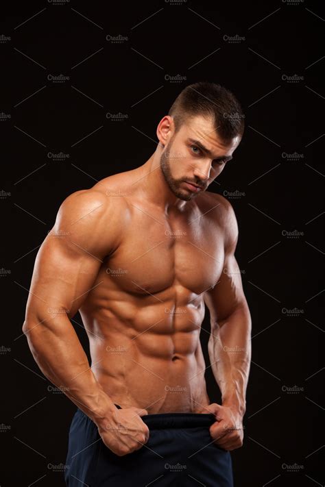 Strong Athletic Man - Fitness Model showing Torso with six pack abs
