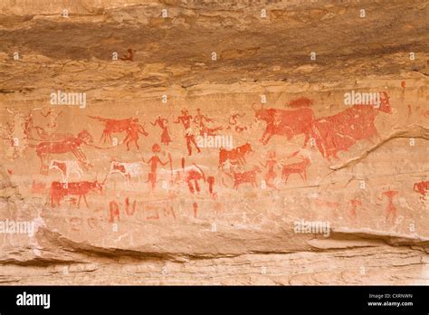 Prehistoric rock carvings, Awis Valley, Acacus Mountains or Tadrart Acacus, Libya, Sahara, North ...