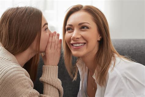 Premium Photo | Daughter telling secret to mother