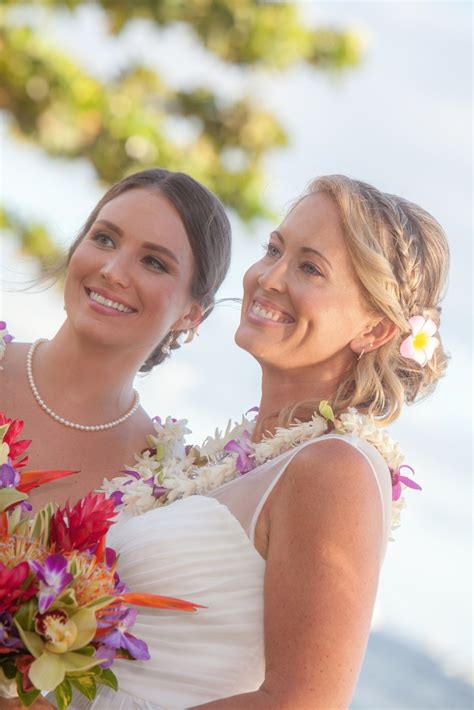 Happy lesbian couple. #weddingday #beach #hawaii | Lesbian bride