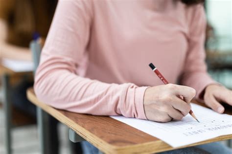 premium photo students sit  exams   desks   classroom