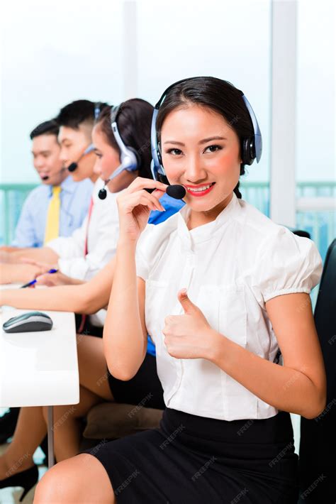 Premium Photo | Asian chinese call center agent team on phone