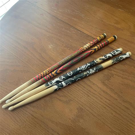 Two sets of drum sticks - Depop