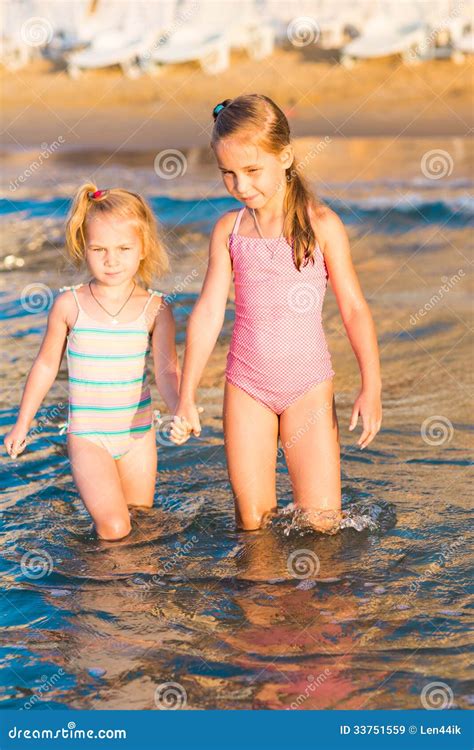 Two Adorable Kids Playing in the Sea on a Beach Stock Image - Image of ...