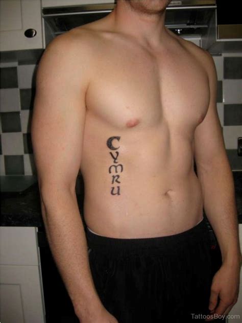 Old English Tattoo Design On Rib - Tattoos Designs