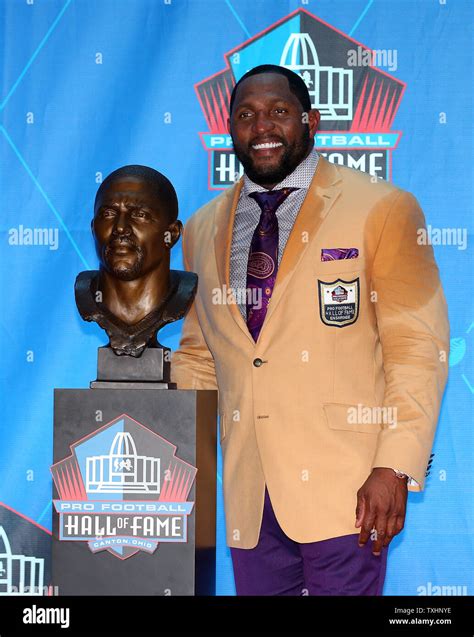 Former Baltimore Raven, Ray Lewis poses with his bust after his enshrinement into the Pro ...