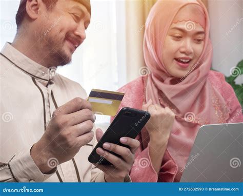 Online Shopping. Happy Muslim Couple Using Digital Tablet and Credit ...