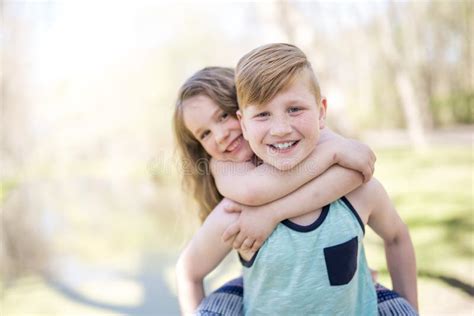 Portrait of a Little Girl on a Yellow Background. with His Brother ...