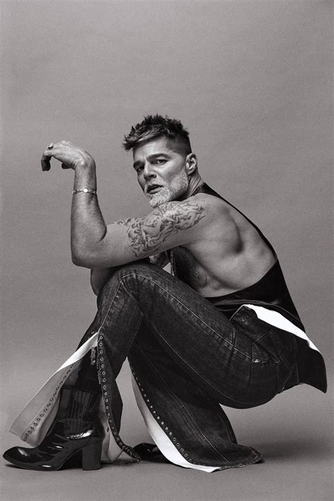 Download Ricky Martin Crouching Down Wallpaper | Wallpapers.com