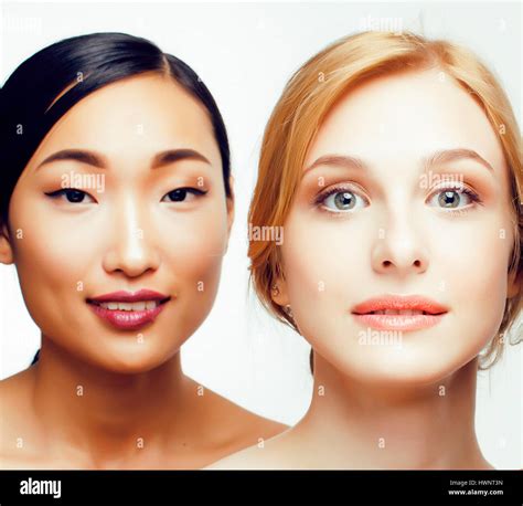 different nation woman: asian, caucasian together isolated on white