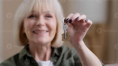 Portrait smiling Caucasian old senior woman female elderly owner seller