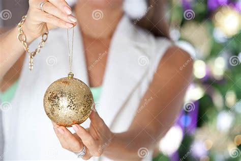 Close Up of Woman Hands Holding Christmas Goold Ball. Stock Photo ...
