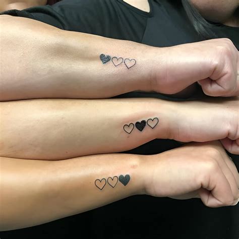 elegant matching heart tattoos     partner asap