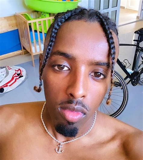 man  dreadlocks   head  staring   camera