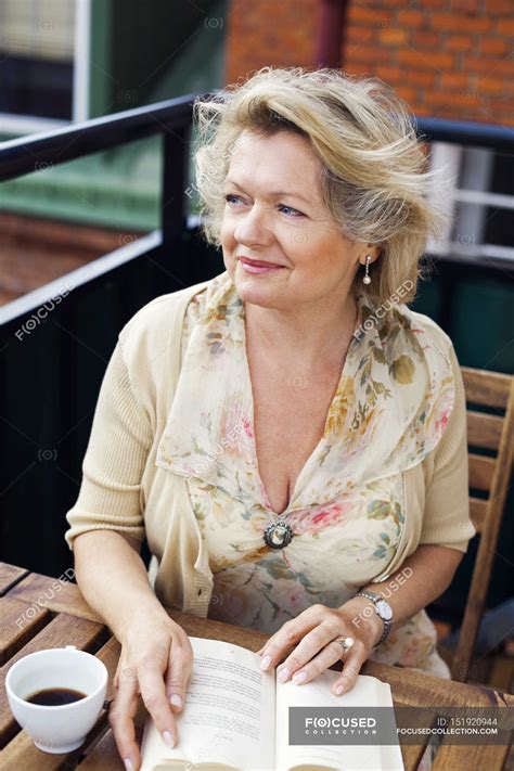 Happy mature woman — Hot Drink, sweden - Stock Photo | #151920944