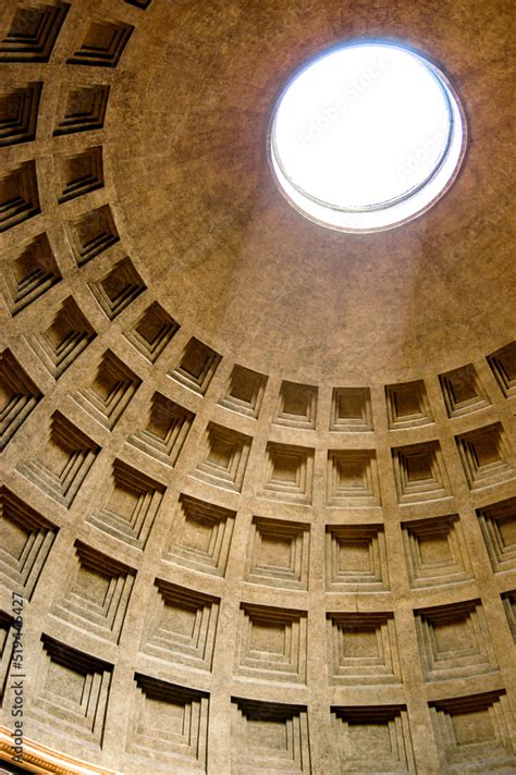 The Pantheon Dome in Rome, Italy as the light shines through the oculus a central opening in the ...