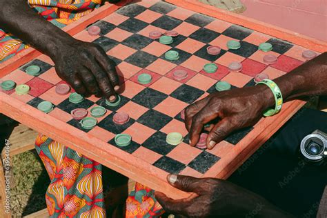 Men playing Draft board game Stock Photo | Adobe Stock