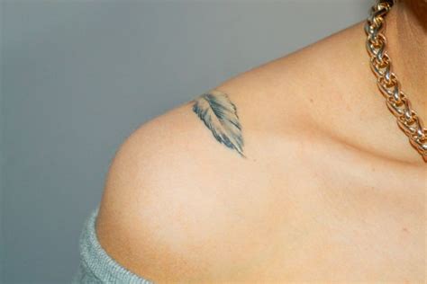 Beautiful small feather tattoo