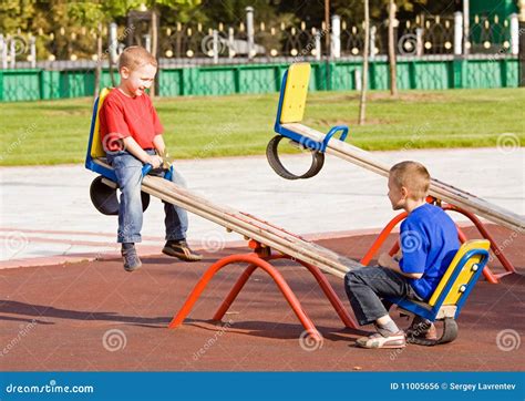 seesaw playground stock   royalty  stock