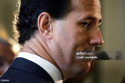 U.S. Senator Rick Santorum speaks to the media after testifying at ...