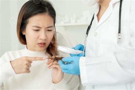 Specialist of hair recheck hair of Asian woman, damaged hair, hair loss