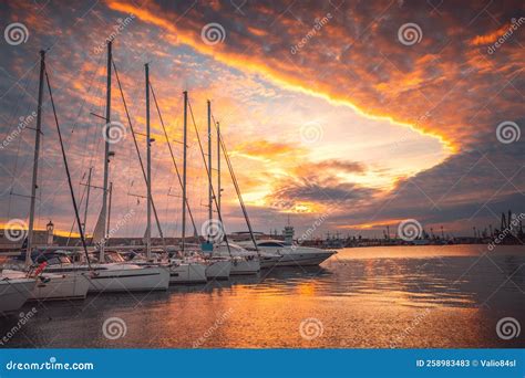 Scenic Sunset Over Luxury Yachts and Sailing Boats in Yacht Port ...