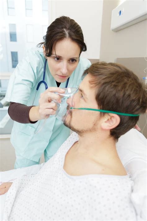 Nurse Set Mask on Patient at Hospital Stock Image - Image of hospital ...