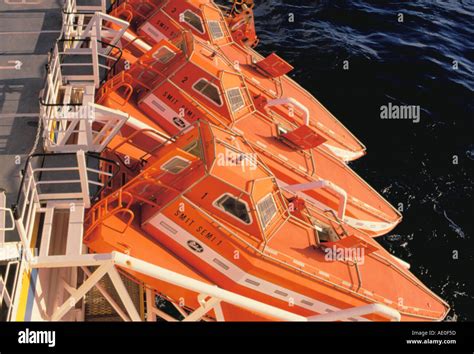 fall  righting lifeboats   oil rig semi  stock photo